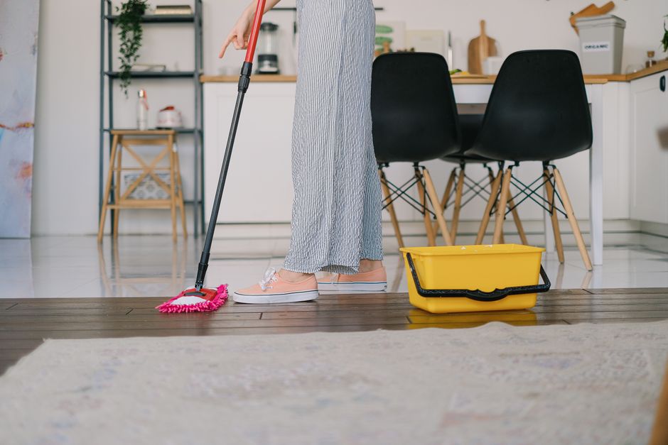 A flat lay of assorted cleaning supplies, perfect for housekeeping themes.